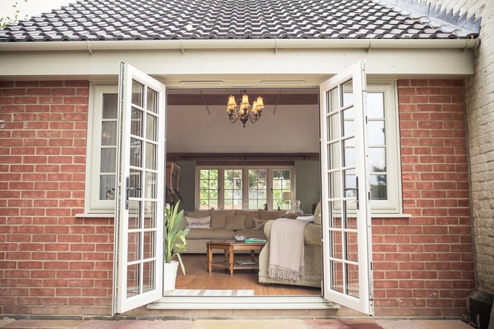 Garden Room with Exposed Beams and French Windows