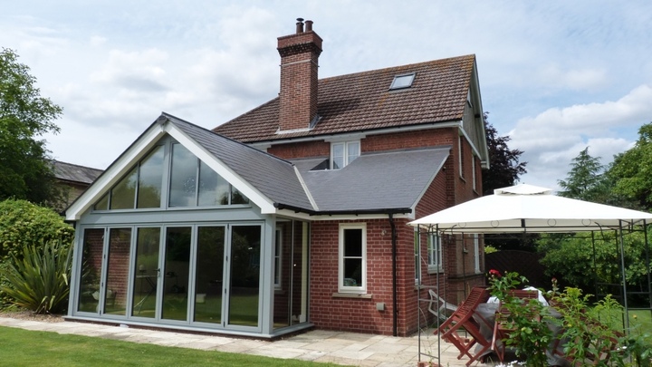 The roof has been cleverly shaped to allow for the existing windows