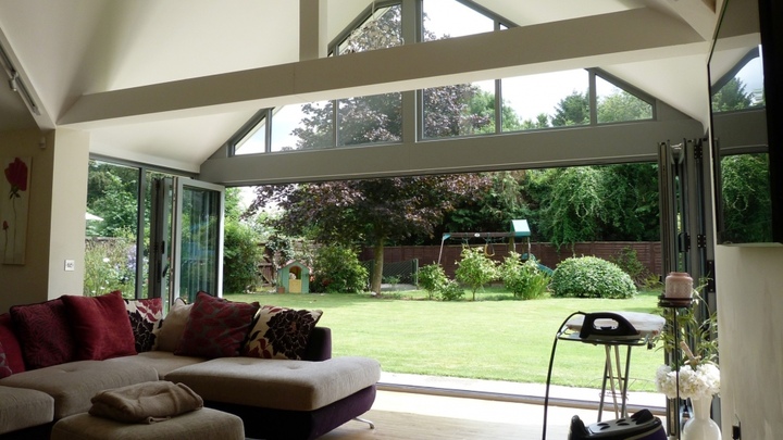 Aluminium windows with bi-fold doors open, interior